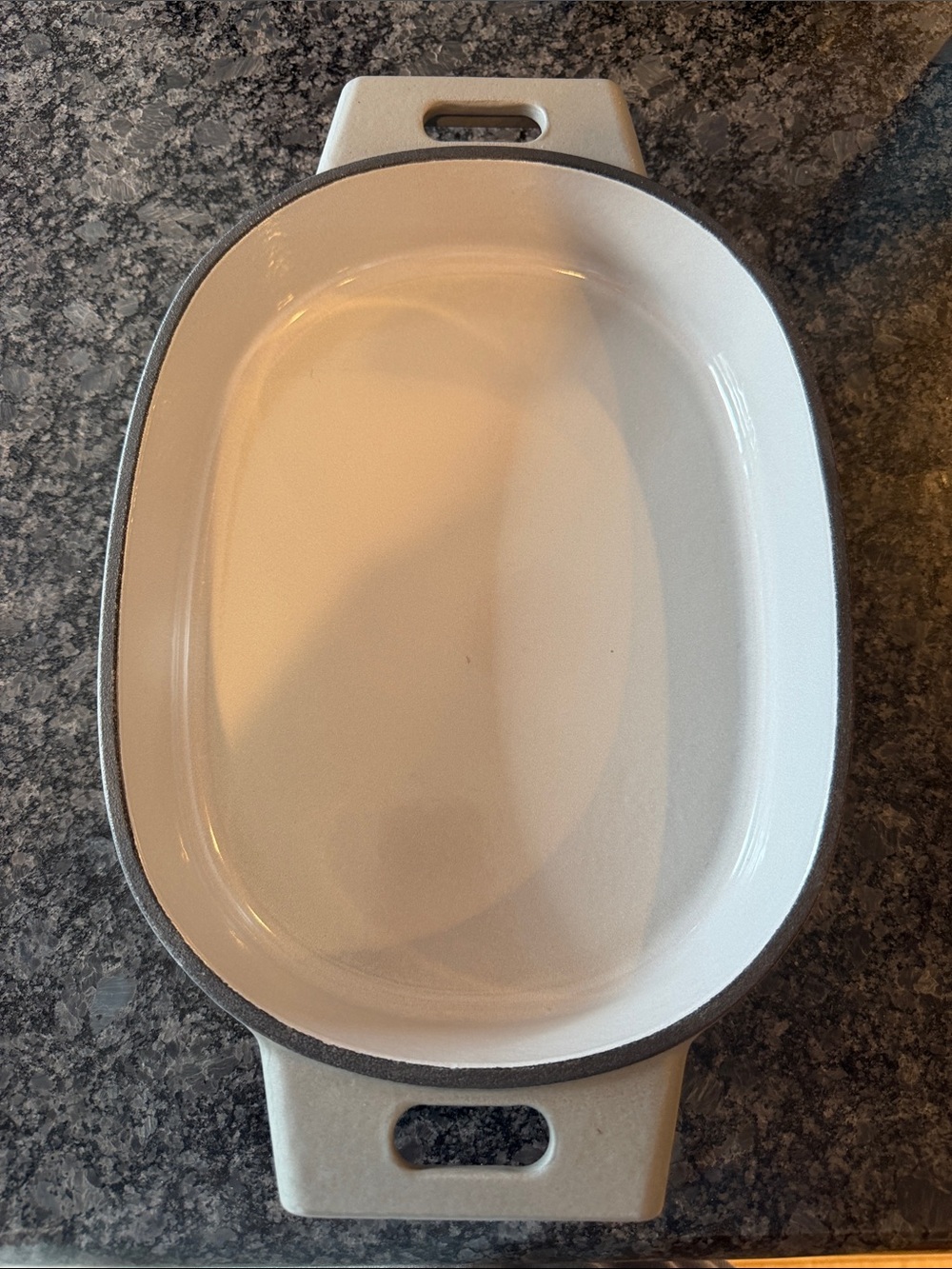 The Pampered Chef Oval 2 qt enameled cast iron baker in Gray.